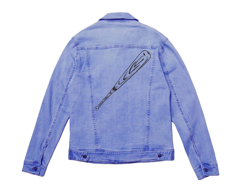 May include: A light blue denim jacket with a black baseball bat graphic on the back.