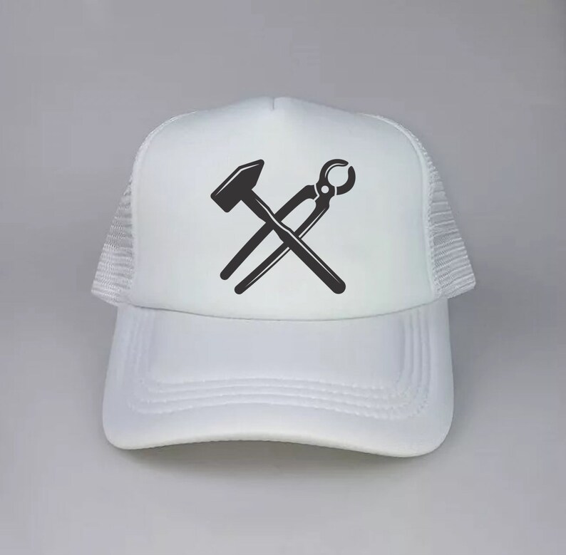 May include: White trucker hat with a black silhouette of a hammer and pliers crossed over each other.