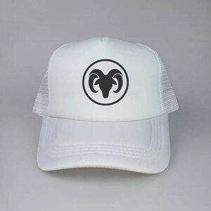 May include: White mesh trucker hat with a black ram silhouette inside a circle on the front.