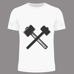 May include: White t-shirt with a black graphic of two crossed hammers.