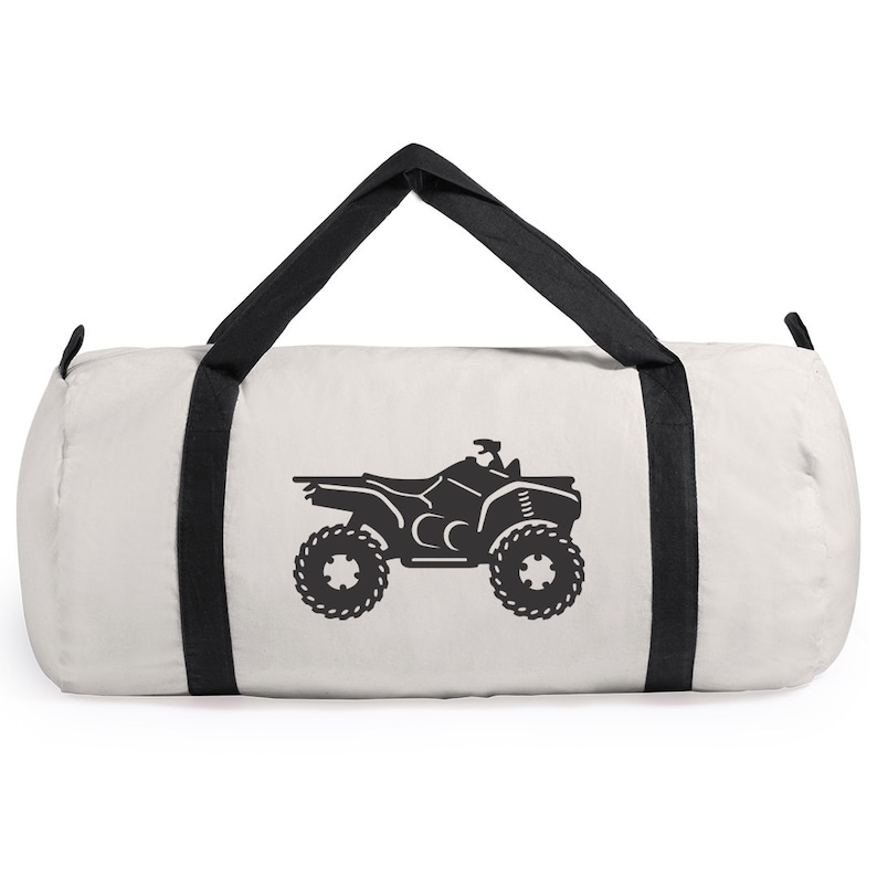 May include: White canvas duffel bag with black straps and a black silhouette of an ATV on the front.