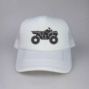 May include: White trucker hat with a black silhouette of an ATV on the front.