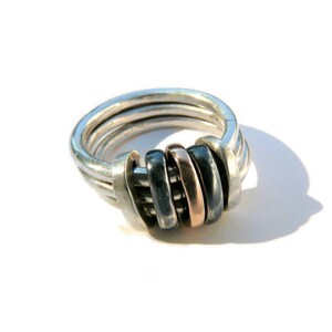 There are different finishes for these 3 rings; brushed, polished, satin finishes and new this year oxidised silver. You can select the colour and metal combinations at the check out.