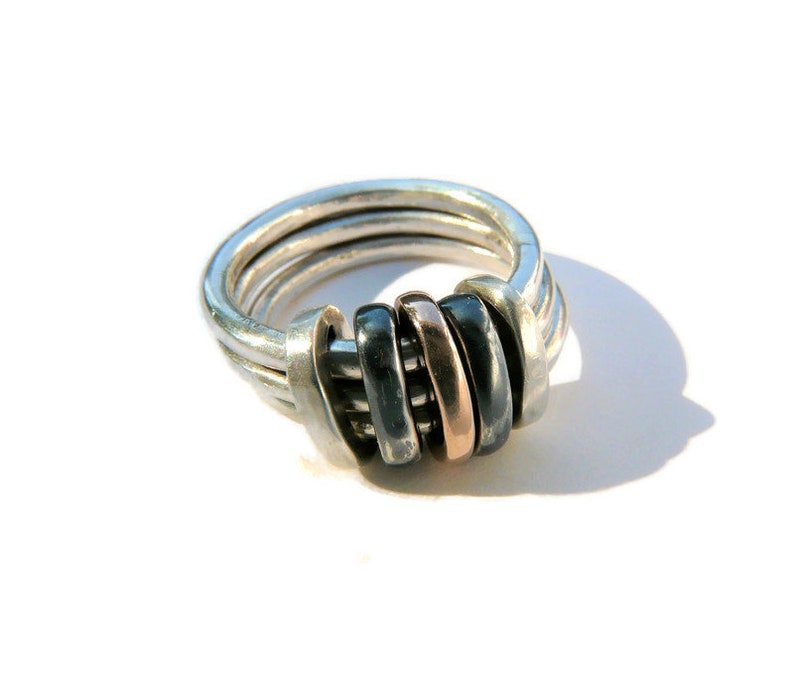 There are different finishes for these 3 rings; brushed, polished, satin finishes and new this year oxidised silver. You can select the colour and metal combinations at the check out.