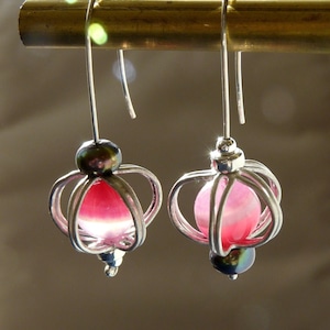 Silver mismatched spinning globe ear wires, cage earrings with bright pink striped agate and black pearl beads,  gift for mothers day