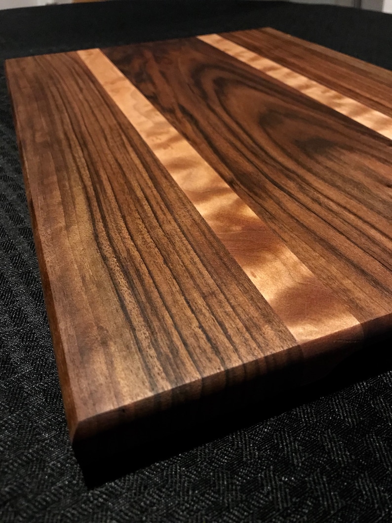 Gorgeous english walnut and quilted maple cutting board.