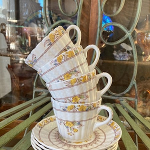 Spode Buttercup Cups and Saucers. Set of 4.  Saucers 5.75 inches diameter. Produced in England 1924 to 1992.