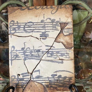 Sid Dickens Memory Block  Music Notation. T-10. 6x8 inches.  Produced  1998. Retired. . Produced in British Columbia.