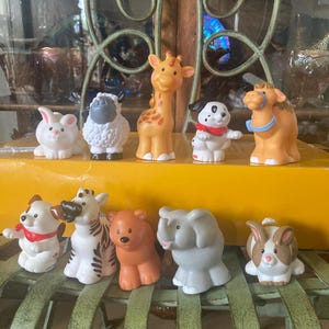 Fisher Price Little People Animals. Set of 10. 2 inches to 3.75 inches tall.  New Condition.