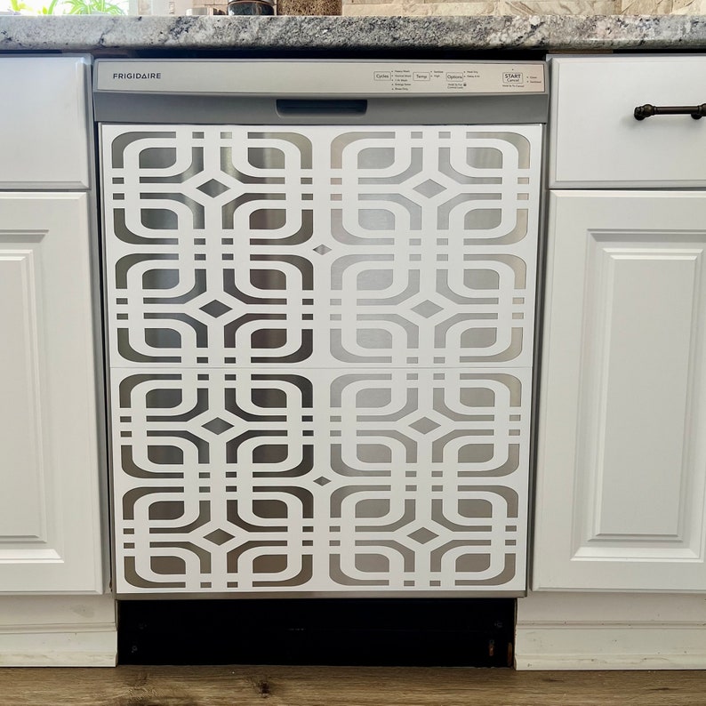 May include: A stainless steel dishwasher with a white geometric pattern on the front. The dishwasher is labeled "FRIGIDAIRE" and has a "START" button.