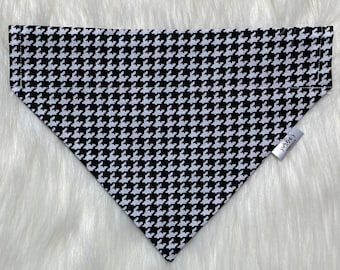 May include: Black and white houndstooth patterned dog bandana with a white tag that says "Waggin'"