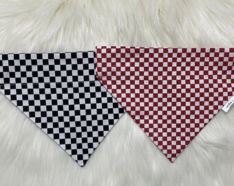 May include: Two checkered dog bandanas, one black and white, and one red and white.