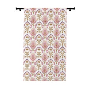 May include: A white curtain with a pink and gold floral pattern. The pattern is a repeating design of stylized flowers and leaves.
