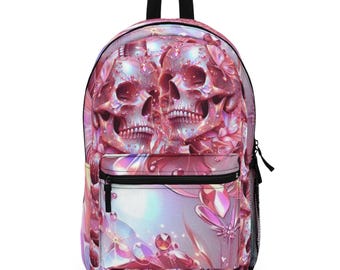 May include: Pink backpack with a floral design featuring two pink skulls with intricate details. The skulls are surrounded by flowers and crystals.