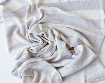 Gray and off-white melange striped toddler blanket knitted of soft merino wool