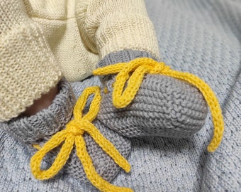 Gray newborn baby booties with yellow ties, first baby socks knitted of 100% merino wool