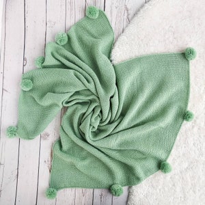 Green baby blanket with pom pom, wool knit baby blanket