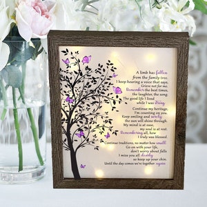 A lighted shadow box featuring a heartfelt memorial quote, elegantly illuminated. The design is available in three color options, creating a warm and thoughtful tribute.