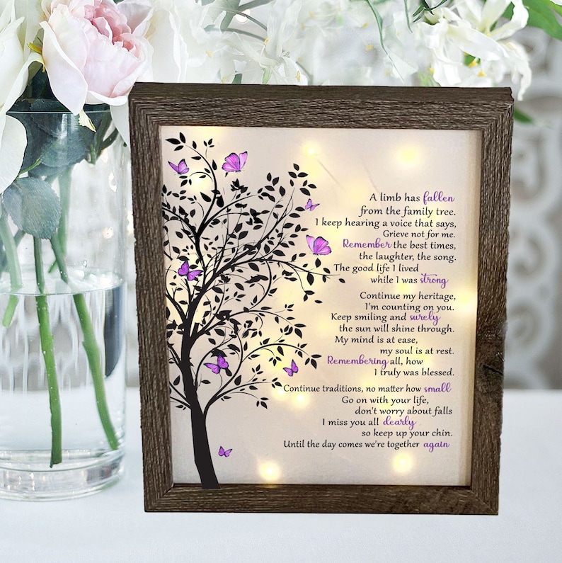 A lighted shadow box featuring a heartfelt memorial quote, elegantly illuminated. The design is available in three color options, creating a warm and thoughtful tribute.