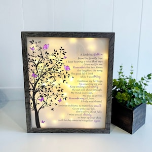 A lighted shadow box featuring a heartfelt memorial quote, elegantly illuminated. The design is available in three color options, creating a warm and thoughtful tribute.