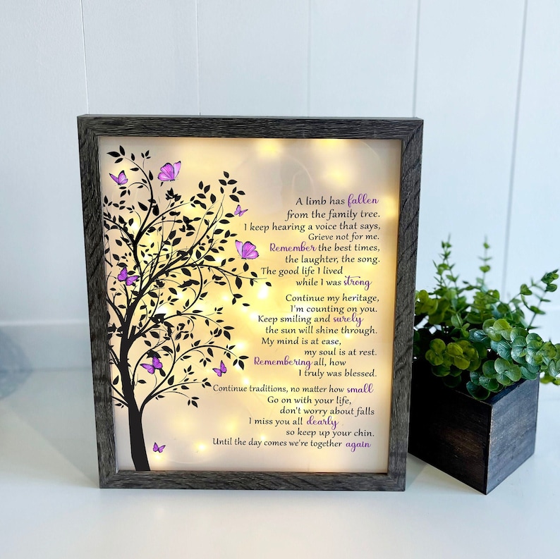 A lighted shadow box featuring a heartfelt memorial quote, elegantly illuminated. The design is available in three color options, creating a warm and thoughtful tribute.