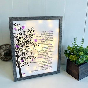 A lighted shadow box featuring a heartfelt memorial quote, elegantly illuminated. The design is available in three color options, creating a warm and thoughtful tribute.