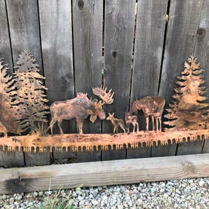 Moose in trees crosscut saw metal wall art