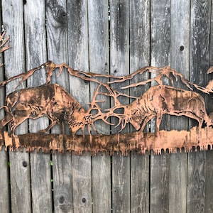 Metalen muurkunst elandvechtende afkortzaag
