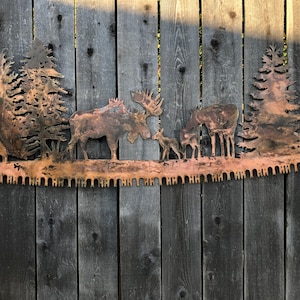 Moose in trees crosscut saw metal wall art