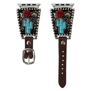 May include: A silver and turquoise watch band with a cactus and rose design. The band is made of leather and has a silver buckle.