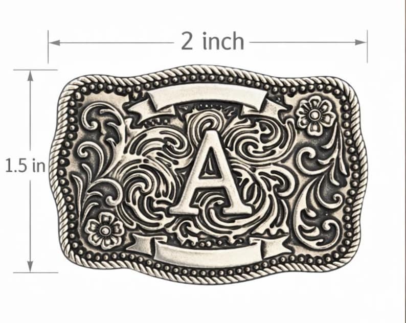 May include: Silver-colored rectangular belt buckle, 2 inches wide and 1.5 inches tall, with an ornate floral and scroll design. The letter "A" is prominently displayed in the center, with two blank banner shapes above and below. The edges are rope-like.