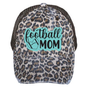 May include: A brown and black leopard print trucker hat with a turquoise blue and black football heart graphic and the text "football mom".