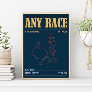May include: A framed print with the words "ANY RACE" in gold lettering. The print features a dark blue background with an orange map design and the text "13.1 MILES". The text "LOUISE HOLLISTER" and "2:24:57" are also visible.