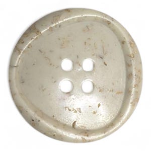 May include: A circular, off-white button featuring four holes. The button has an uneven shape and is speckled with tiny, brown flecks. This button is made from a robust material and is suitable for various sewing projects.