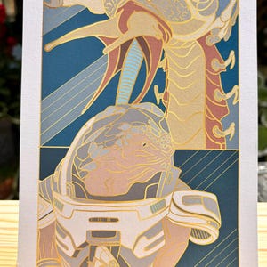 May include: A gold and blue illustration of a space marine in a helmet holding a weapon, with a large alien creature in the background.