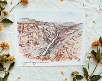 Op de afbeelding: Een aquarel van het Grand Canyon National Park. De schildering toont de gelaagde rotsformaties van de canyon met een rivier die er doorheen slingert.