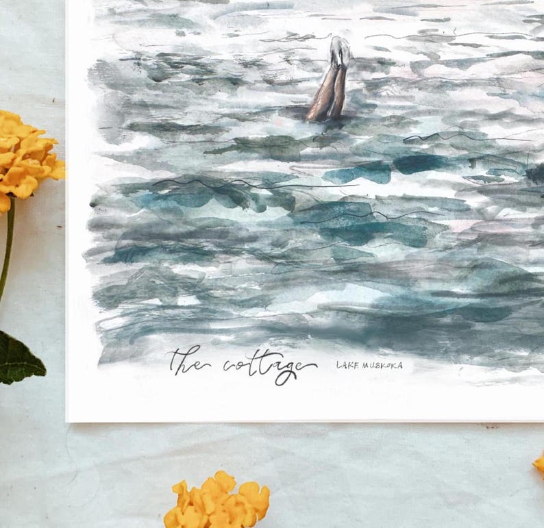 May include: Watercolor print of a lake scene with a person swimming. The artwork features shades of blue and gray, with the text "the cottage" and "Lake Muskoka" in the lower portion. Yellow flowers are in the foreground.