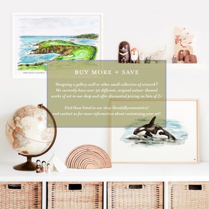 May include: A display of framed art prints and decorative items. The art includes a watercolor of a golf course and an orca whale. Other items include a globe, wooden toys, and a rainbow stacker. Text on the image reads "BUY MORE + SAVE".
