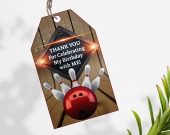 May include: A thank you tag with a bowling theme. The tag is brown with a black and silver frame with the text "THANK YOU For Celebrating My Birthday with ME!" inside. There are five white bowling pins and a red bowling ball in the image.