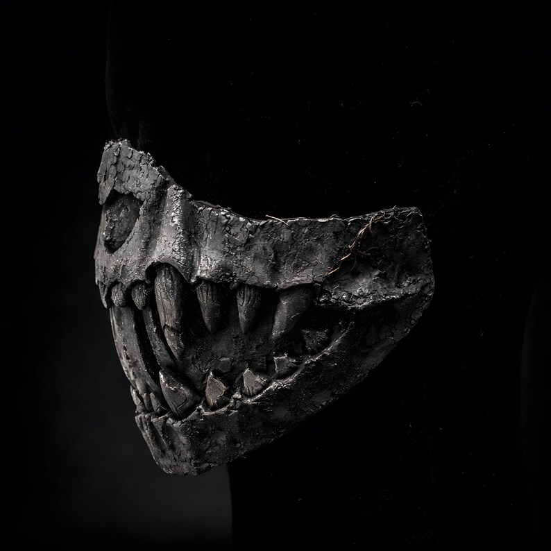 Side view of half mask with fangs, handmade macabre mask highlighting fang profile and lightweight structure
