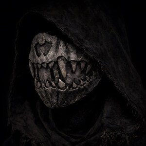 Half mask with fangs worn by model, handmade wearable dark art mask for performance, LARP and dark roleplay