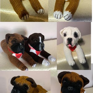 May include: Five knitted boxer dog plushies in various colors, including brown, black, and white. Each plush has a personalized name tag, including "Jackson", "Wilcie", and "Harlow".