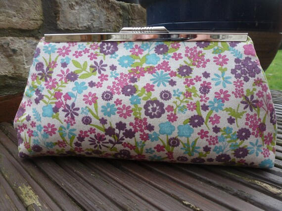 multi coloured clutch bag
