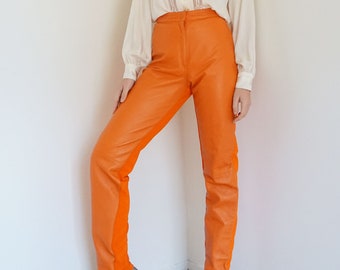 orange faux leather pants