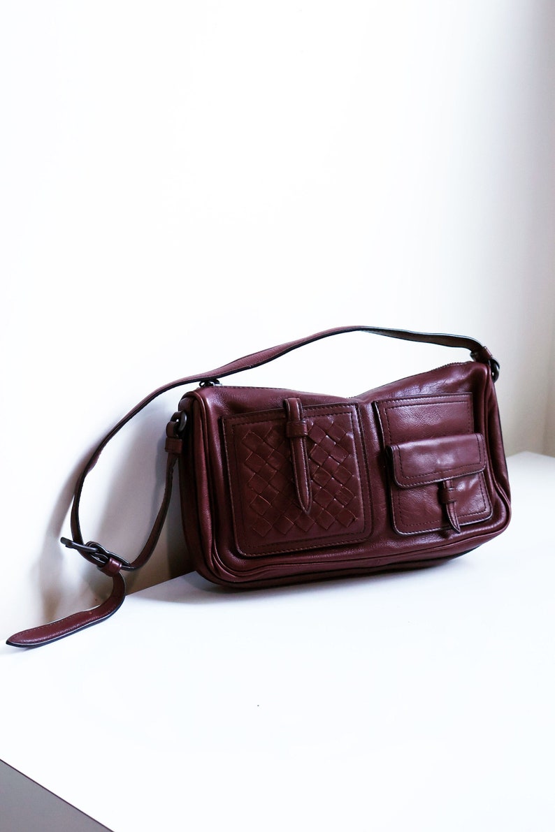 Bottega Veneta Bordeaux Leather Multi Pocket Baguette Bag with Intrecciato Pocket Detail Woven Burgundy Maroon Red 90s Y2K image 1