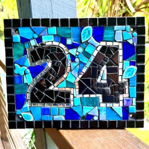 May include: A trio of ceramic mugs with a speckled, matte finish in cream, light grey, and dark grey. Each mug features a simple, minimalist design, ideal for tea or coffee.