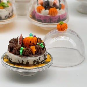 Miniature Halloween Ghost Pumpkin Cake made polymer clay, which is cute with a tray and cake cover. miniature 1:12 scale