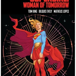 May include: A DC Compact Comics graphic novel titled Supergirl: Woman of Tomorrow by Tom King, Bilquis Evely, and Matheus Lopes. The cover features a blonde character in a blue and red costume with a flowing red cape against a black space background.