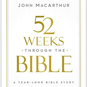 May include: A book cover with the title "52 Weeks Through The Bible" by John MacArthur. The title is in gold lettering on a white background with a gold border. The subtitle reads "A Year-Long Bible Study."