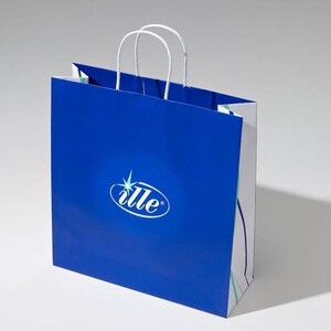 May include: A blue paper shopping bag with white handles and a white and blue design. The bag has a logo that says "ille" with a star above it.